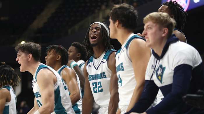 The UNCW bench reacts as the Seahawks move toward their 60-57 win against Charleston in a CAA tournament semifinal at the Entertainment & Sports Arena in Washington, D.C., Monday, March 7, 2022.
